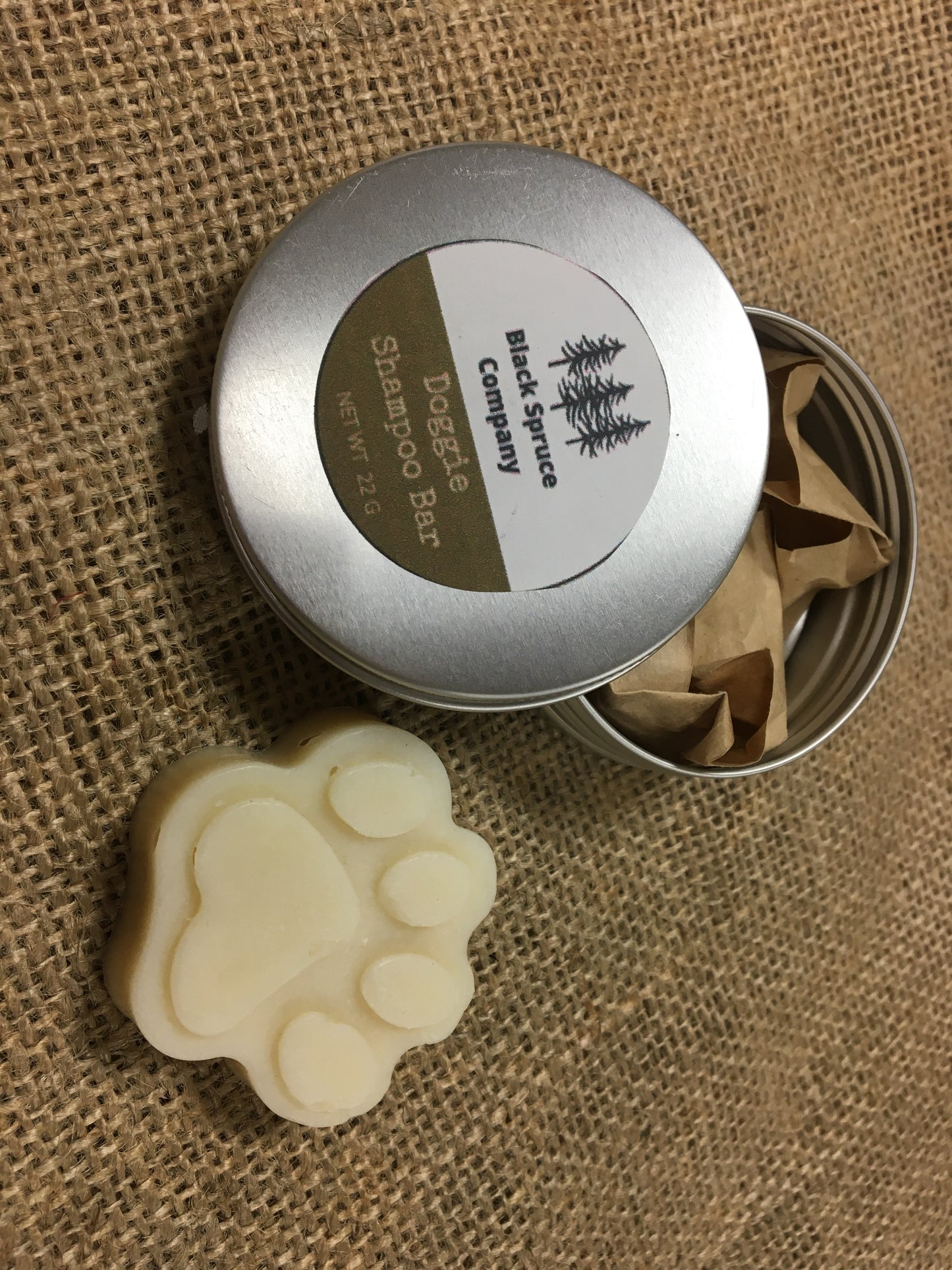 Dog Shampoo Bar alongside shampoo tin