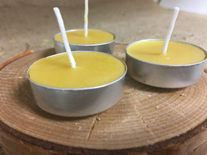 Three Beeswax Tea Lights up close